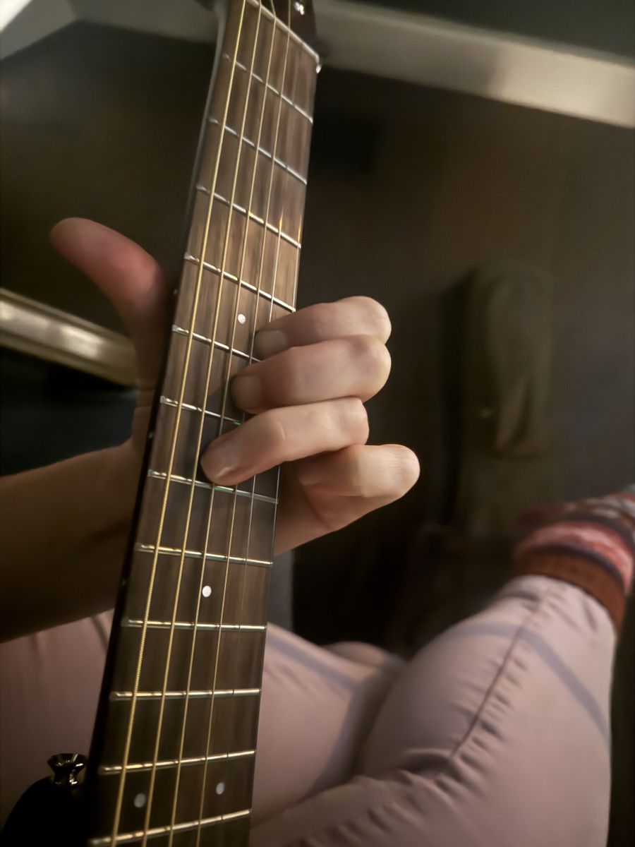 Hands on a guitar